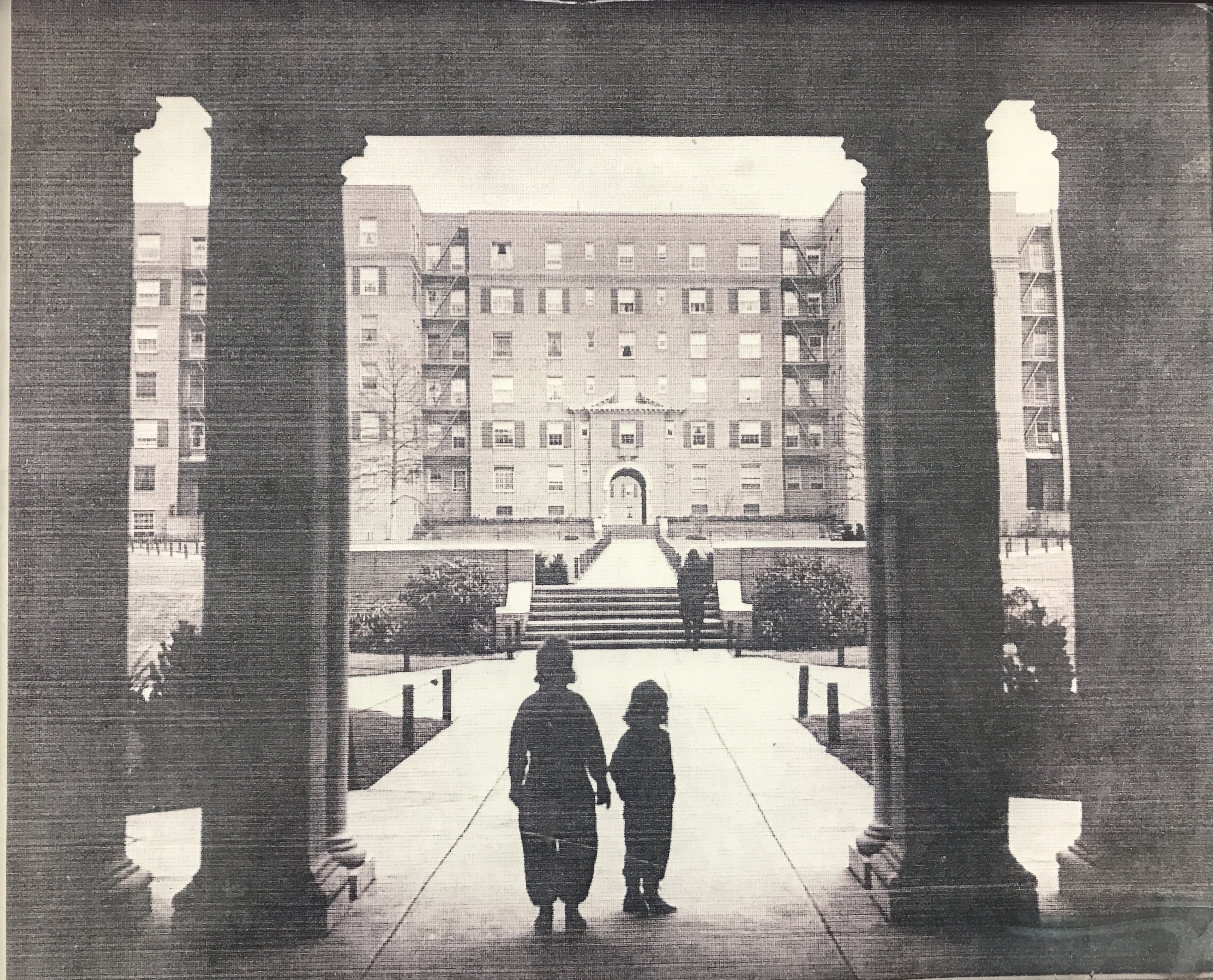 Two children standing in front of the main entryway of Boulevard Gardens in its early years